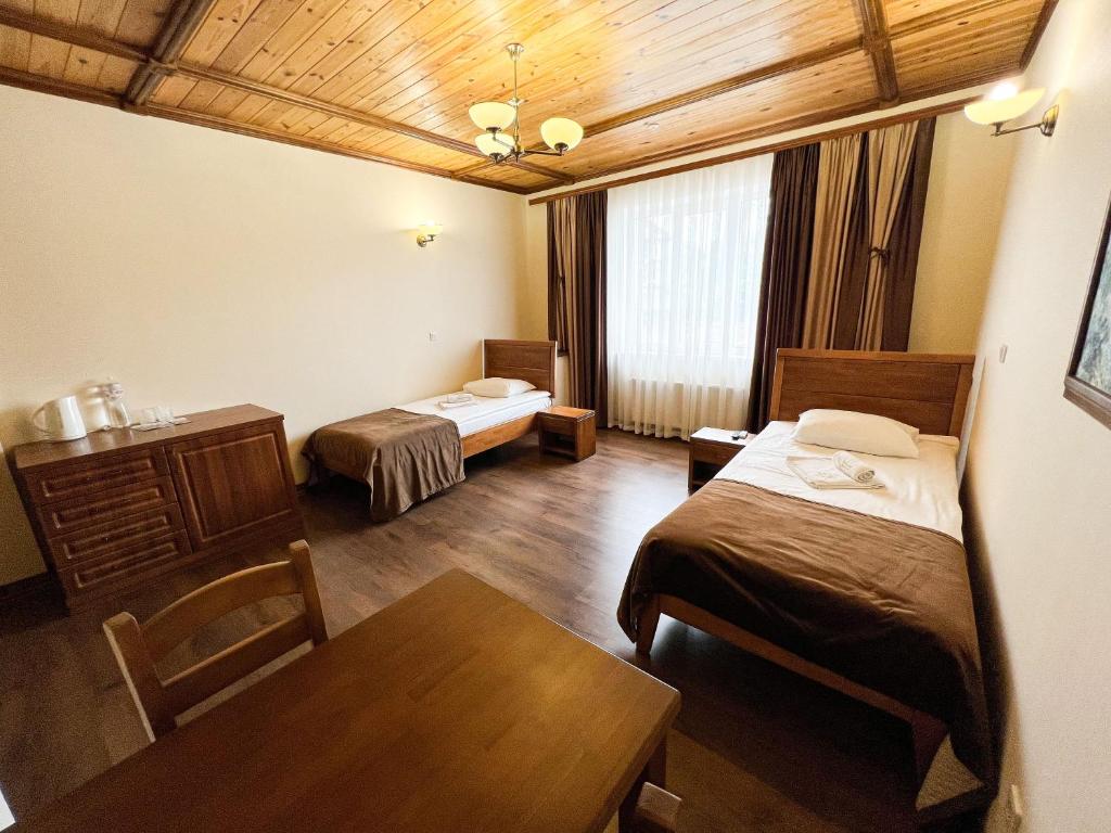 Покращений номер з окремими ліжками 1